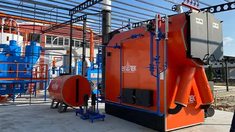 Chaudière à vapeur avec chargeur automatique